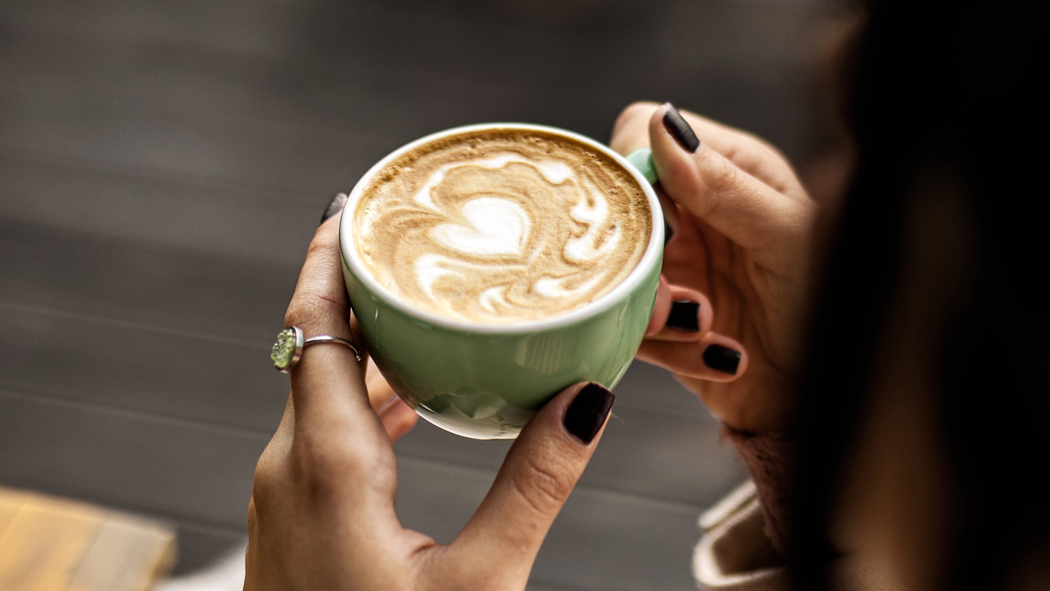 How to drink coffee with Invisalign woman