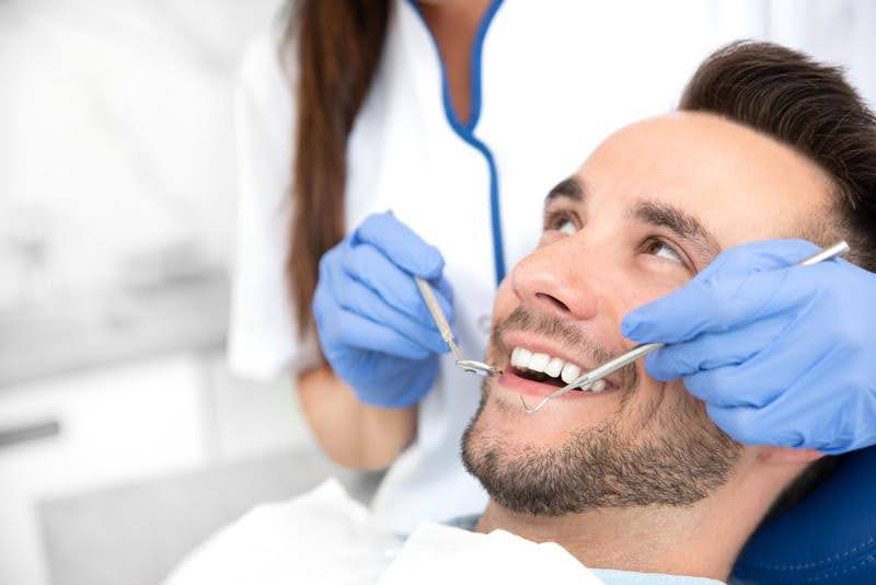 Adult orthodontics cost for a male patient during dental consultation