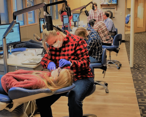 Egger Orthodontics Flannel Day The Egger Orthodontics team treating patients during a flannel-themed office day.